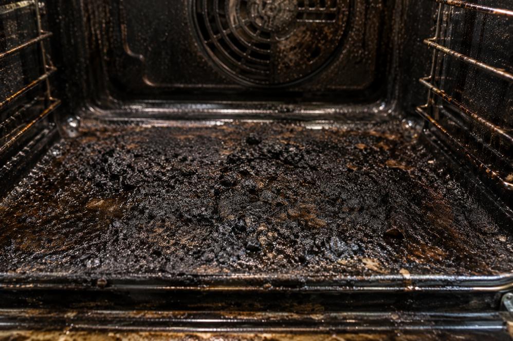 Heavy black carbon buildup inside a dirty oven