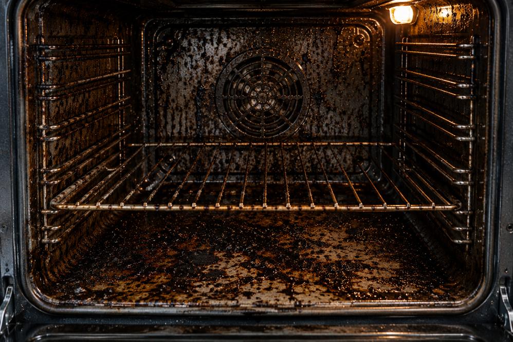 Dirty oven with heavy grease and carbon buildup in Mandurah home